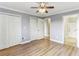 Bedroom featuring wood floors, a ceiling fan, and closet space adjacent to the Primary bath at 300 Johnson Ferry Ne Rd # A811, Atlanta, GA 30328