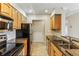 Updated kitchen featuring stainless steel appliances, granite countertops, and wood cabinets at 300 Johnson Ferry Ne Rd # A811, Atlanta, GA 30328