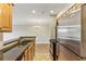 Updated kitchen with stainless steel appliances, granite countertops, wood cabinets and a stainless refrigerator at 300 Johnson Ferry Ne Rd # A811, Atlanta, GA 30328