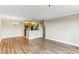 Bright, open-concept living room and kitchen with wood floors and a modern chandelier create an inviting space at 300 Johnson Ferry Ne Rd # A811, Atlanta, GA 30328