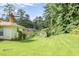 The home has a large backyard with a utility shed at 3563 Carriage Way, East Point, GA 30344