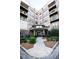 Elegant condo building entrance with well-manicured landscaping and secure entry at 898 Oak St Sw # 1215, Atlanta, GA 30310