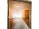 View of an empty room highlighting the neutral wall paint, the carpet, and an interior door at 898 Oak St Sw # 1215, Atlanta, GA 30310