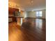 Open floor plan with hardwood floors connecting kitchen to living area at 898 Oak St Sw # 1215, Atlanta, GA 30310