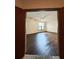 Living room view showing the hardwood floors, light fixture, and window at 898 Oak St Sw # 1215, Atlanta, GA 30310