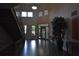 Apartment lobby features tile floors, a decorative plant, stairs, and glass doors at 898 Oak St Sw # 1215, Atlanta, GA 30310