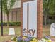Attractive sign for Sky Lofts is surrounded by colorful flowers at 898 Oak St Sw # 1215, Atlanta, GA 30310
