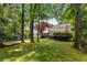 Expansive backyard with a hammock, established trees, and view of the back deck offering a peaceful retreat at 999 Seaboard Nw Ave, Atlanta, GA 30318