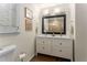 Bright bathroom featuring double sinks, vanity and hardwood floors at 999 Seaboard Nw Ave, Atlanta, GA 30318