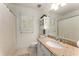 Bright bathroom with granite countertops and shower with curtain at 999 Seaboard Nw Ave, Atlanta, GA 30318