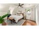 Cozy bedroom features a ceiling fan, hardwood floors, and natural light at 999 Seaboard Nw Ave, Atlanta, GA 30318
