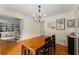 Dining room with hardwood floors, a large table, and access to living spaces at 999 Seaboard Nw Ave, Atlanta, GA 30318