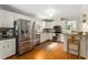 Bright kitchen with stainless steel appliances, white cabinets, and hardwood floors at 999 Seaboard Nw Ave, Atlanta, GA 30318