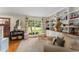 Living room featuring hardwood floors, built-in shelves, and lots of natural light at 999 Seaboard Nw Ave, Atlanta, GA 30318