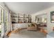 Bright living room with built-in bookshelves, hardwood floors, and large windows at 999 Seaboard Nw Ave, Atlanta, GA 30318