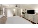 Well-lit main bedroom featuring a ceiling fan, a dresser and hardwood floors at 999 Seaboard Nw Ave, Atlanta, GA 30318