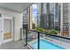 Balcony showcases clear city views, pool, and glass railing to enjoy scenery at 1280 W Peachtree Street Nw # 808, Atlanta, GA 30309