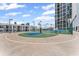 Multi-use outdoor recreational space with a basketball hoop and a small tennis court at 1280 W Peachtree Street Nw # 808, Atlanta, GA 30309