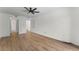 Bright bedroom featuring wood-look flooring and a ceiling fan, creating a modern and comfortable living space at 1280 W Peachtree Street Nw # 808, Atlanta, GA 30309