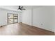 Bedroom with wood floors, ceiling fan, and sliding glass doors to the outside at 1280 W Peachtree Street Nw # 808, Atlanta, GA 30309