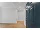 View from entryway with wood floors; a front door offers an inviting peek into a neutrally colored space with recessed lighting at 1280 W Peachtree Street Nw # 808, Atlanta, GA 30309