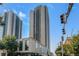 Exterior view of a high-rise condominium building showcasing its architectural design and the surrounding urban landscape at 1280 W Peachtree Street Nw # 808, Atlanta, GA 30309