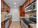 Galley kitchen features stainless steel appliances and granite countertops at 1280 W Peachtree Street Nw # 808, Atlanta, GA 30309