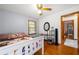 Bedroom with hardwood floors, ceiling fan, and natural light at 135 5Th Ave, Jonesboro, GA 30236