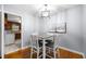 Dining area featuring a modern light fixture and stylish table set at 135 5Th Ave, Jonesboro, GA 30236