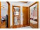 Hallway showcasing hardwood floors and doorways to other rooms, providing seamless transitions at 135 5Th Ave, Jonesboro, GA 30236