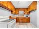 A modest kitchen featuring light blue walls and wood cabinets at 135 5Th Ave, Jonesboro, GA 30236