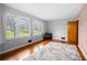 Living area features hardwood floors, light walls, and natural light from the windows at 135 5Th Ave, Jonesboro, GA 30236