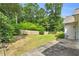 Spacious backyard featuring lawn and partial fence at 1530 Brisbane Dr, Dacula, GA 30019