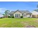 Well-maintained backyard featuring a lush green lawn and privacy fence at 1530 Brisbane Dr, Dacula, GA 30019
