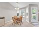 Cozy breakfast nook with natural light, tile floor, and a view of the backyard, attached to the kitchen at 1530 Brisbane Dr, Dacula, GA 30019