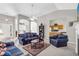Cozy living room with plush furnishings, neutral carpet, and arched openings, leading to other areas of the home at 1530 Brisbane Dr, Dacula, GA 30019