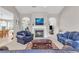 Comfortable living room featuring a fireplace, plush seating, and arched doorways that lead to adjacent rooms at 1530 Brisbane Dr, Dacula, GA 30019