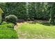 Spacious backyard with mature trees and a well-maintained lawn at 2822 Prado Ln, Marietta, GA 30066