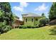 Exterior of home with a nice lawn, deck, and lush landscaping at 2822 Prado Ln, Marietta, GA 30066