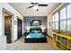 Nicely decorated bedroom with unique painting, ceiling fan, neutral carpet, and shuttered windows at 2822 Prado Ln, Marietta, GA 30066