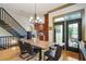 Bright dining room with wood table, view to backyard, and access to gourmet kitchen at 2822 Prado Ln, Marietta, GA 30066