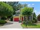 Traditional two-story home with red garage door, red front door, and tidy landscaping at 2822 Prado Ln, Marietta, GA 30066
