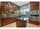 Gourmet kitchen features custom cabinetry, granite countertops, stainless steel appliances, and center island at 2822 Prado Ln, Marietta, GA 30066