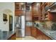 Cherry cabinets, stainless steel appliances, and granite countertops highlight this updated kitchen at 2822 Prado Ln, Marietta, GA 30066