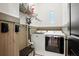 Laundry room features a front load washer and dryer with wall mounted vacuum at 2822 Prado Ln, Marietta, GA 30066