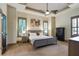 Spacious main bedroom boasts a trey ceiling, a large window and an ensuite bathroom at 2822 Prado Ln, Marietta, GA 30066