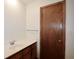 Bathroom featuring white sink and vanity, door, and modern faucet at 3409 Shorelake Dr, Tucker, GA 30084