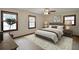 Inviting bedroom with natural light, calm decor, a comfortable queen-sized bed, and classic design at 3409 Shorelake Dr, Tucker, GA 30084
