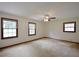 Bedroom with windows, ceiling fan, and carpeted floors at 3409 Shorelake Dr, Tucker, GA 30084