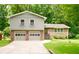 Charming two-story home featuring a brick facade, a two-car garage, and a well-maintained front yard at 3409 Shorelake Dr, Tucker, GA 30084